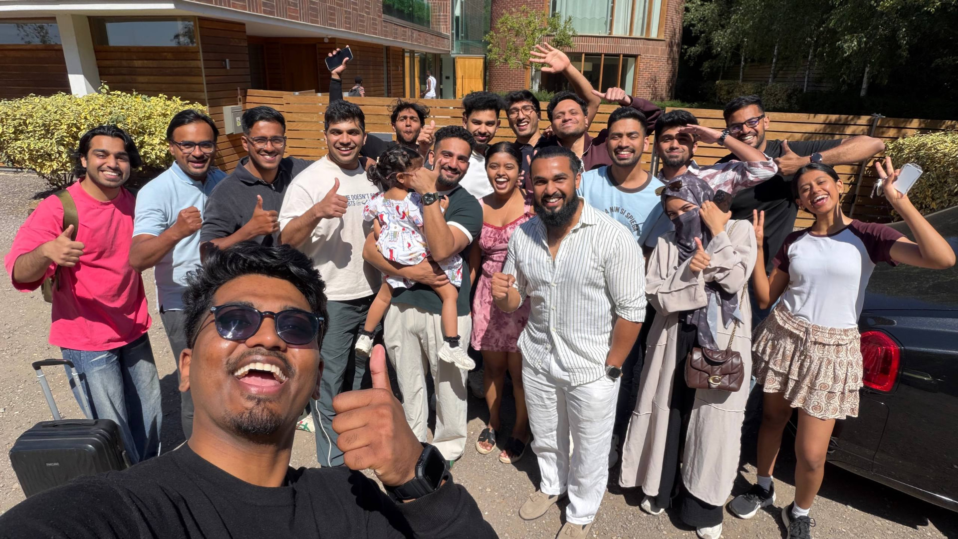 Members gathered outside a stayover house before a monthly meetup