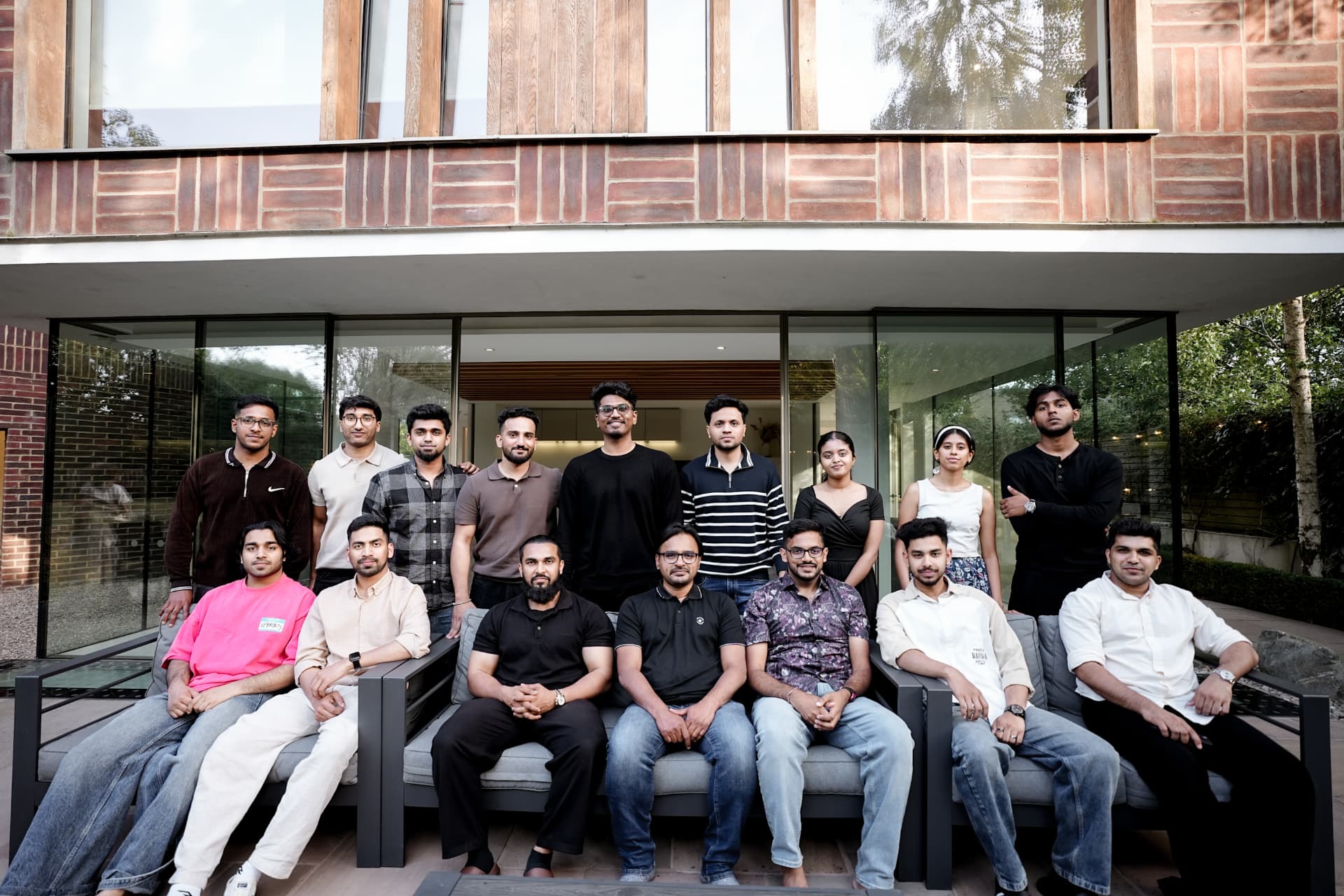 A group portrait outside a property at a meetup