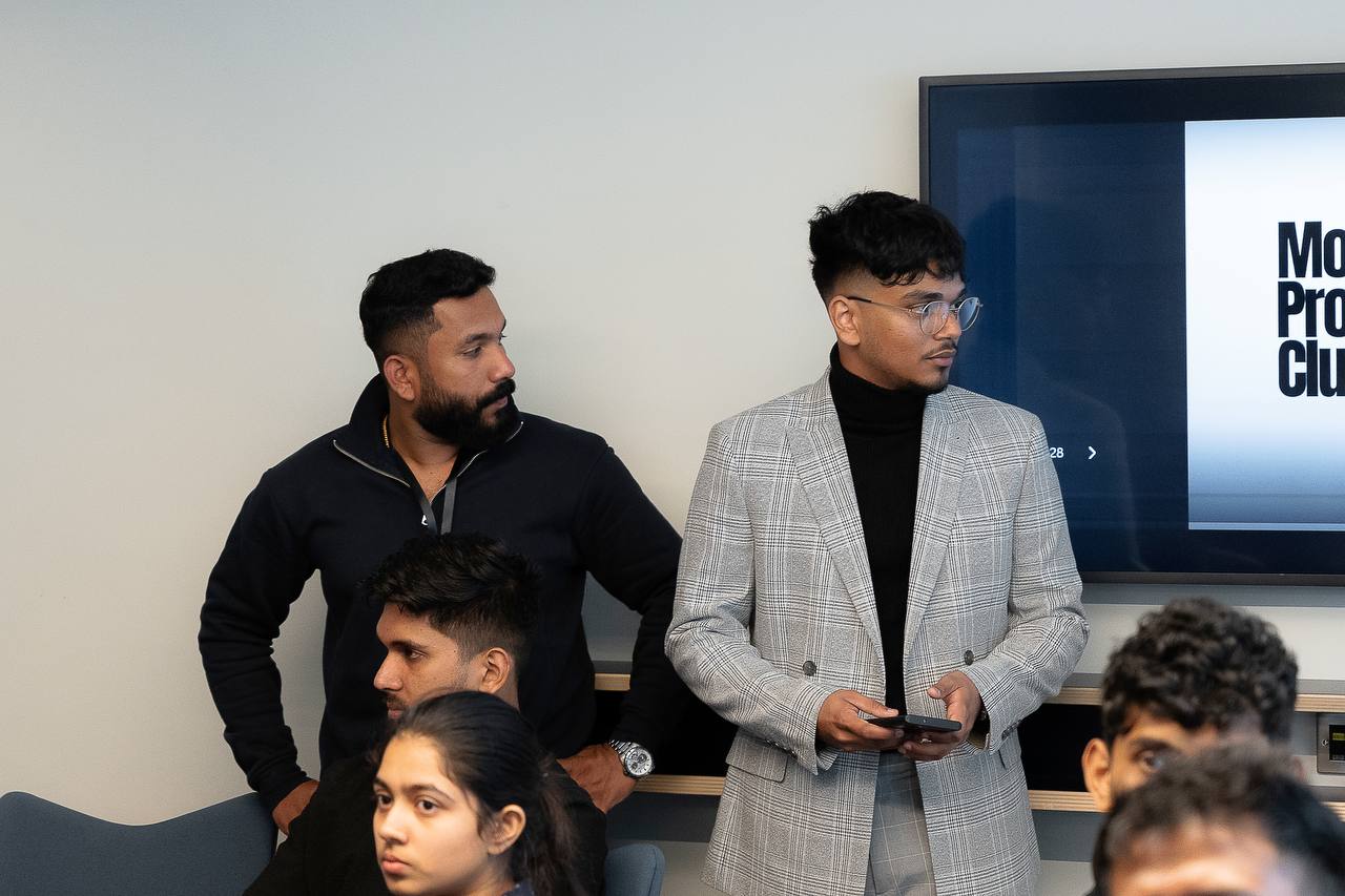 A member presenting to the room during a monthly meetup