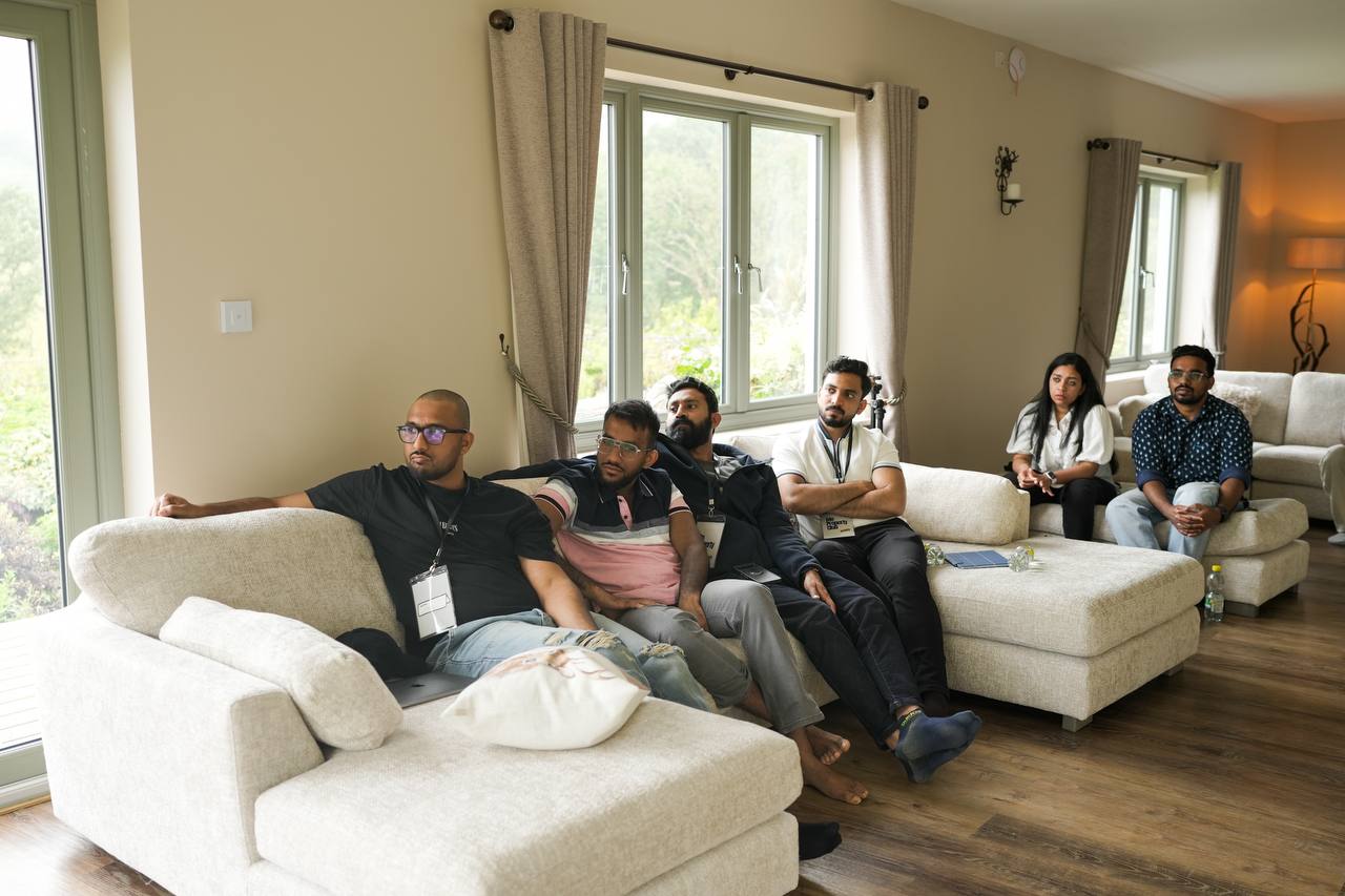 The group listening during a mastermind session at a stayover