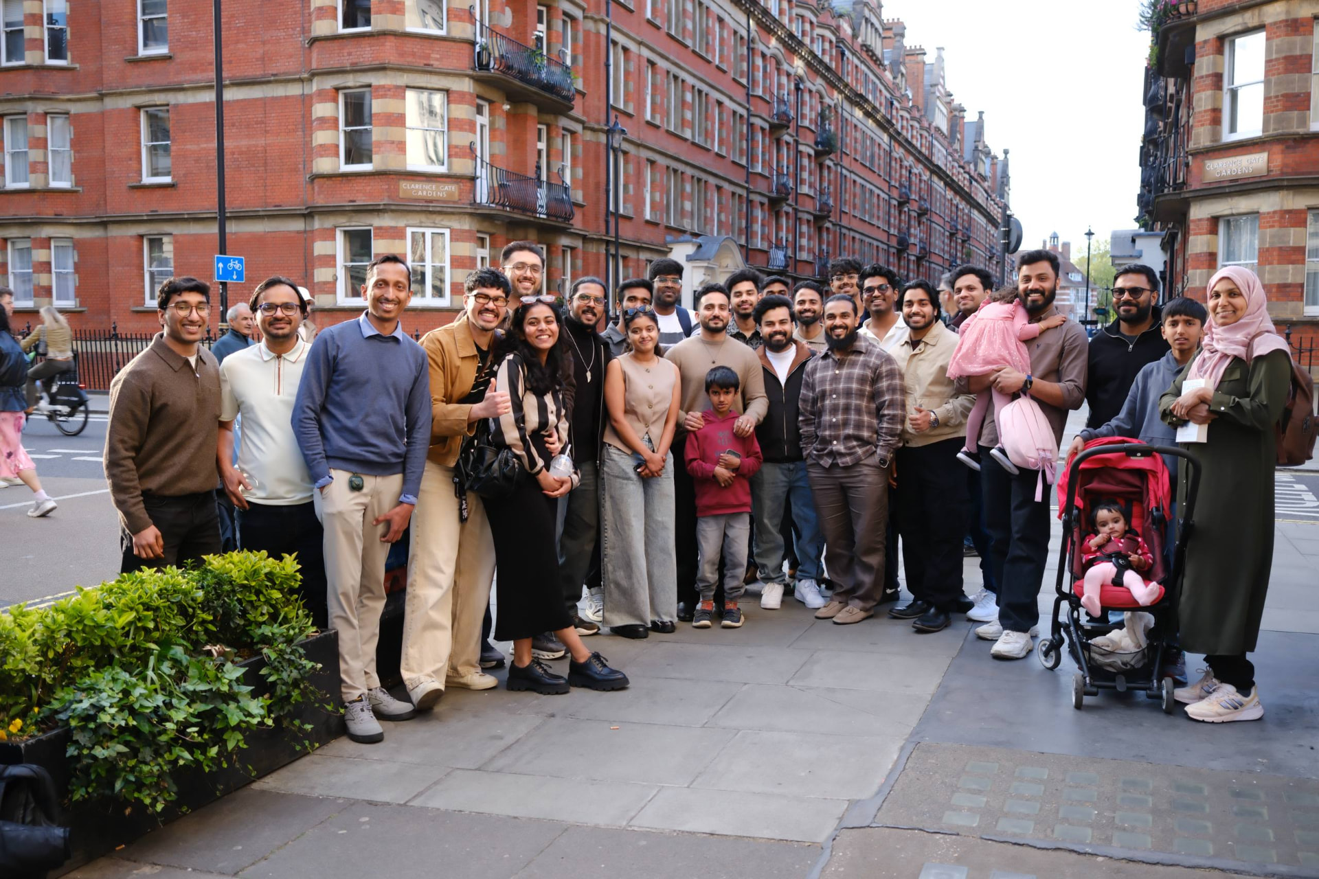 Members applauding at a monthly meetup