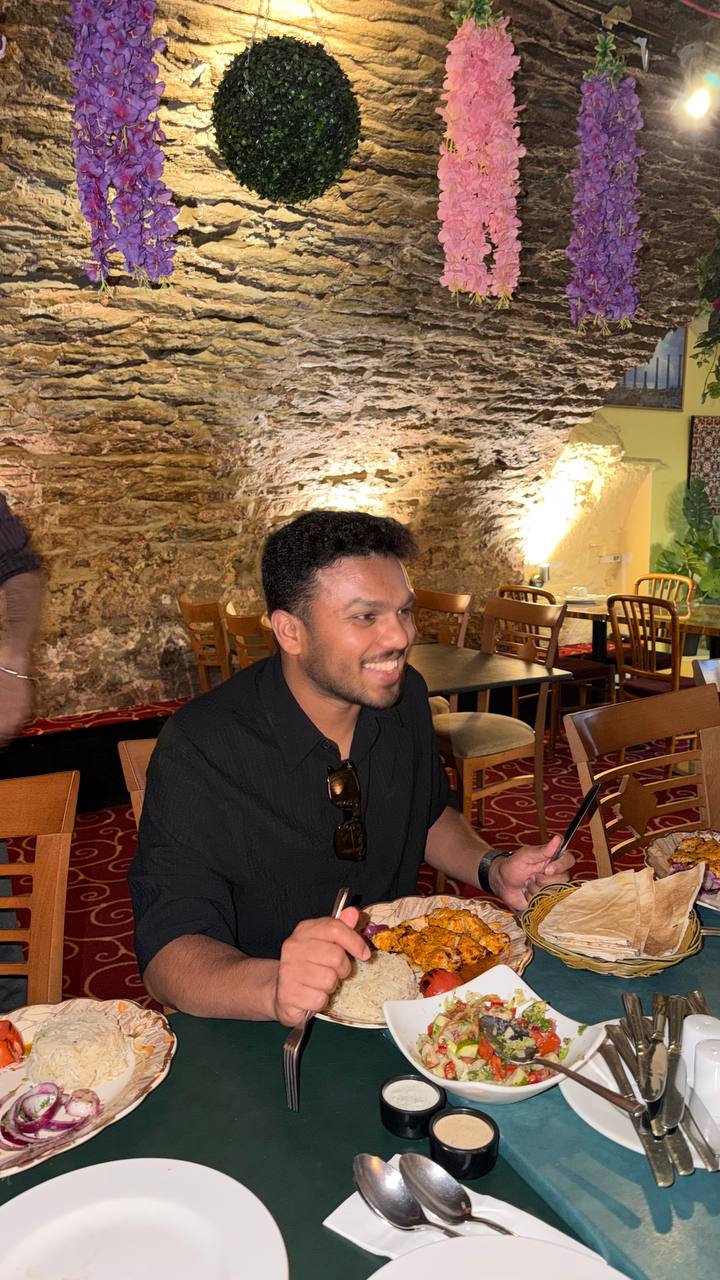 A member sharing a meal during a community experience