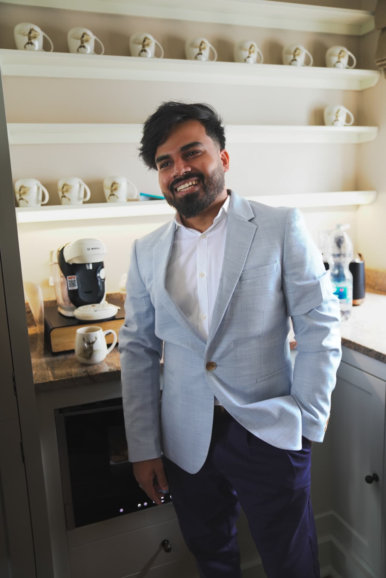 A member smiling during a break at a meetup stayover