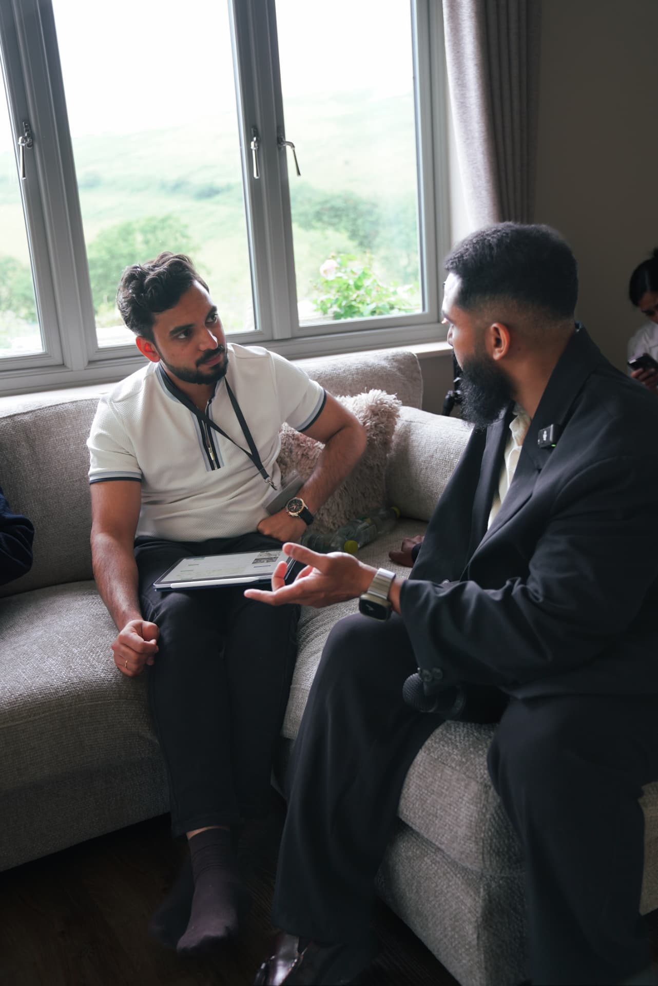 Two members in conversation during a meetup stayover