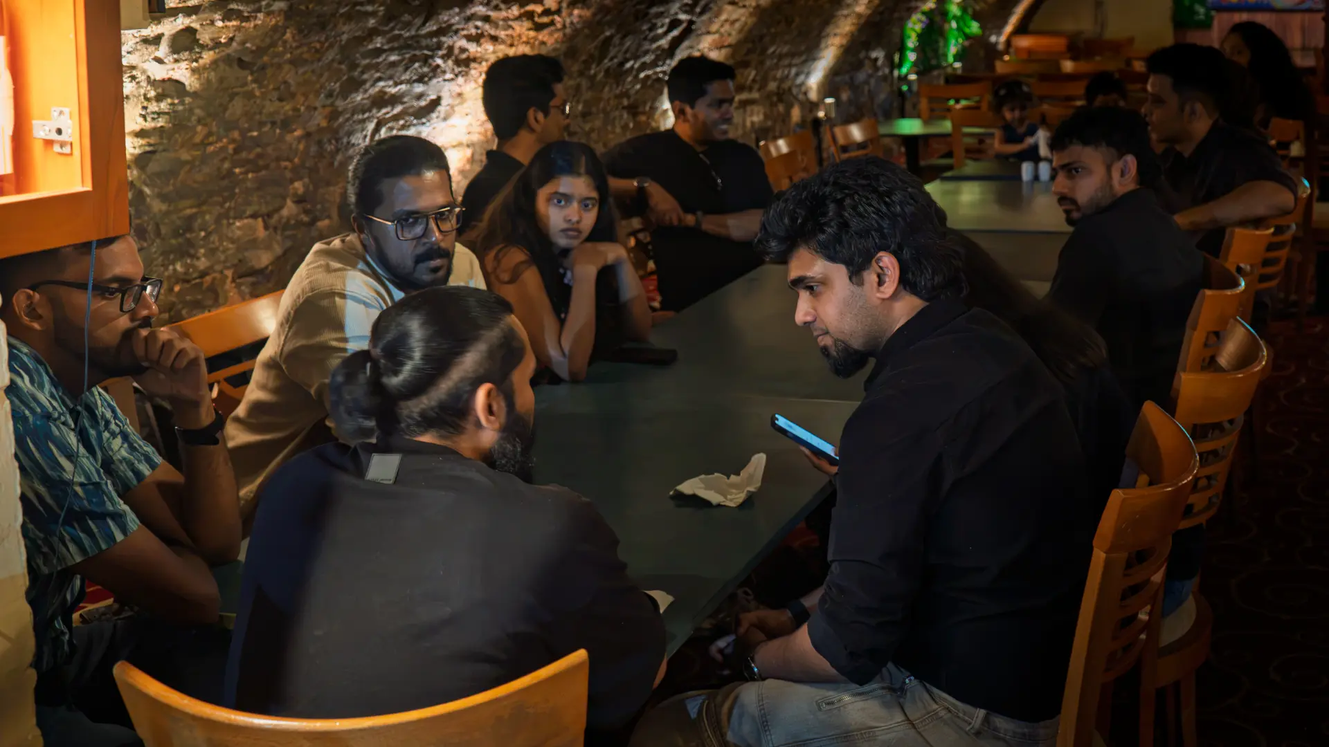 Members around the table during a meetup dinner