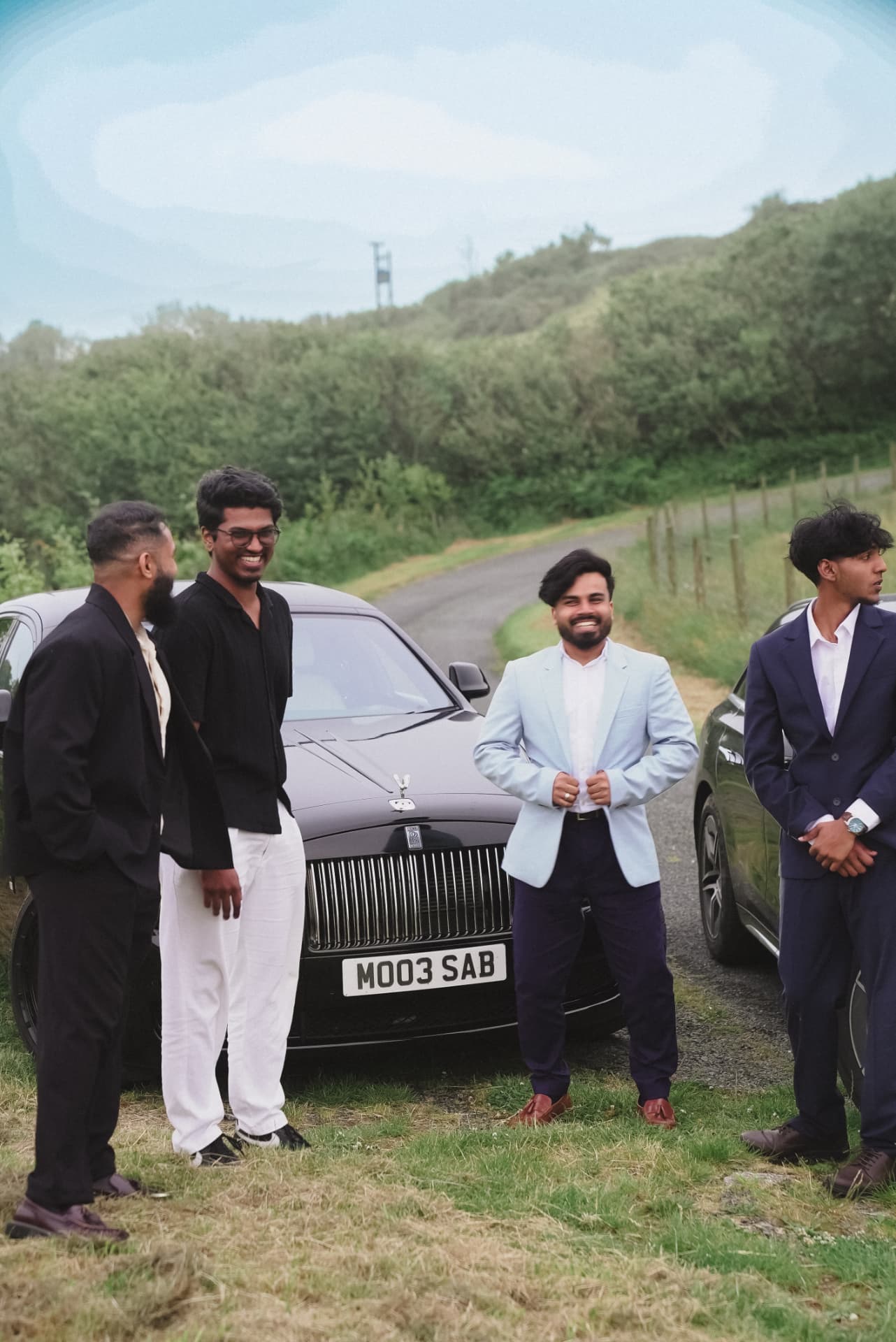 Members gathered by a car during a community experience