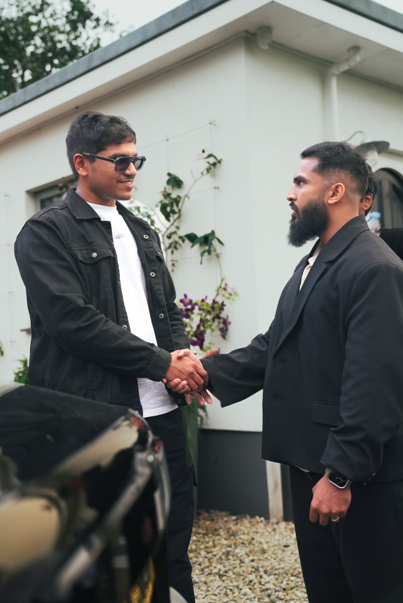 Two members greeting each other at an experience gathering