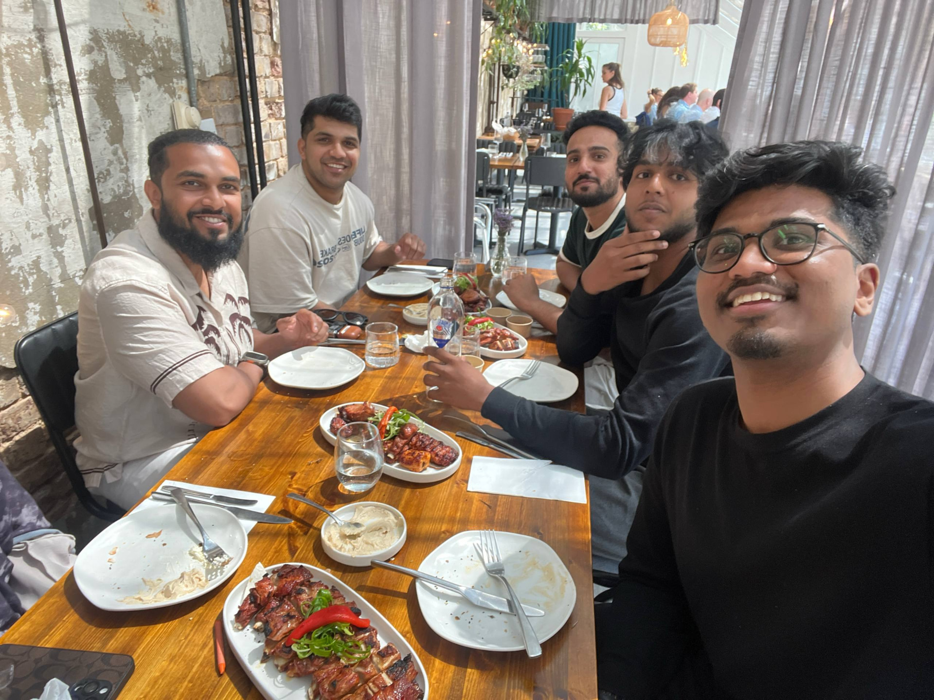 Members sharing a meal together during a community experience